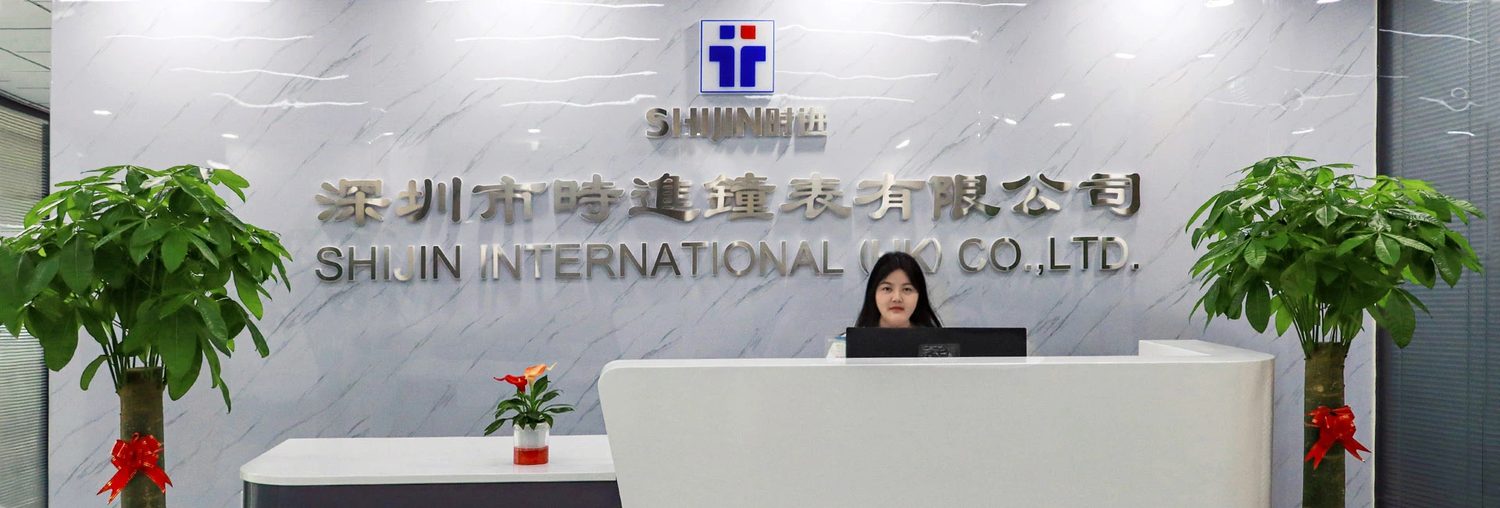 The reception desk, under the company name board in Chinese and English.